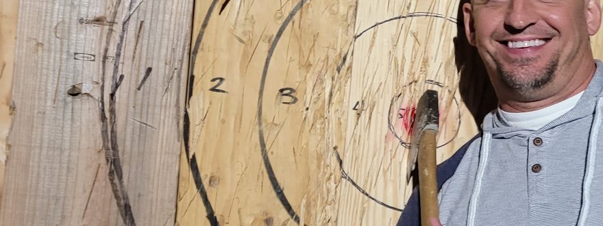 An axe stuck near the bullseye
